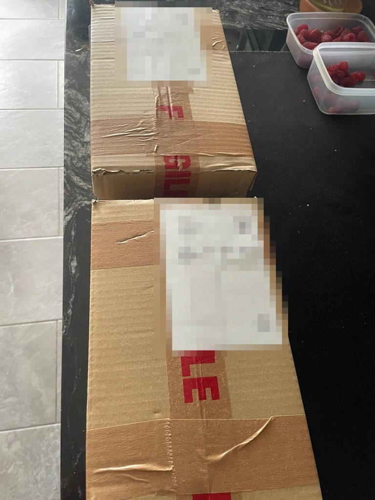 The first delivery of Grym Drops, boxed and waiting in Wrexham